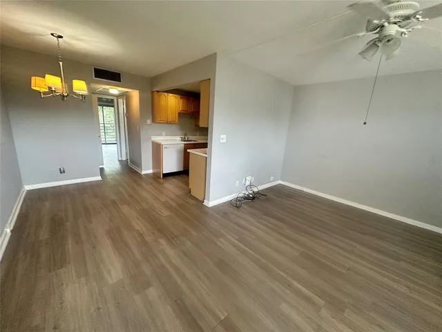 a view of a livingroom with wooden floor