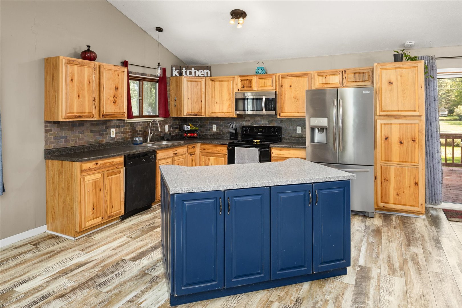 3440 Cardinal Lane Morris, IL 60450 - Photo 9 of 34 a kitchen with stainless steel appliances granite countertop a refrigerator a sink dishwasher and wooden cabinets with wooden floor