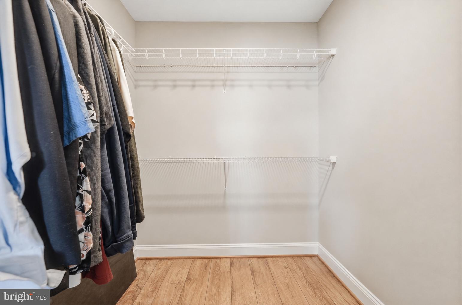 6301 Edsall Road, Unit 519 Alexandria, VA 22312 - Photo 15 of 33 a view of walk in closet with wooden floor