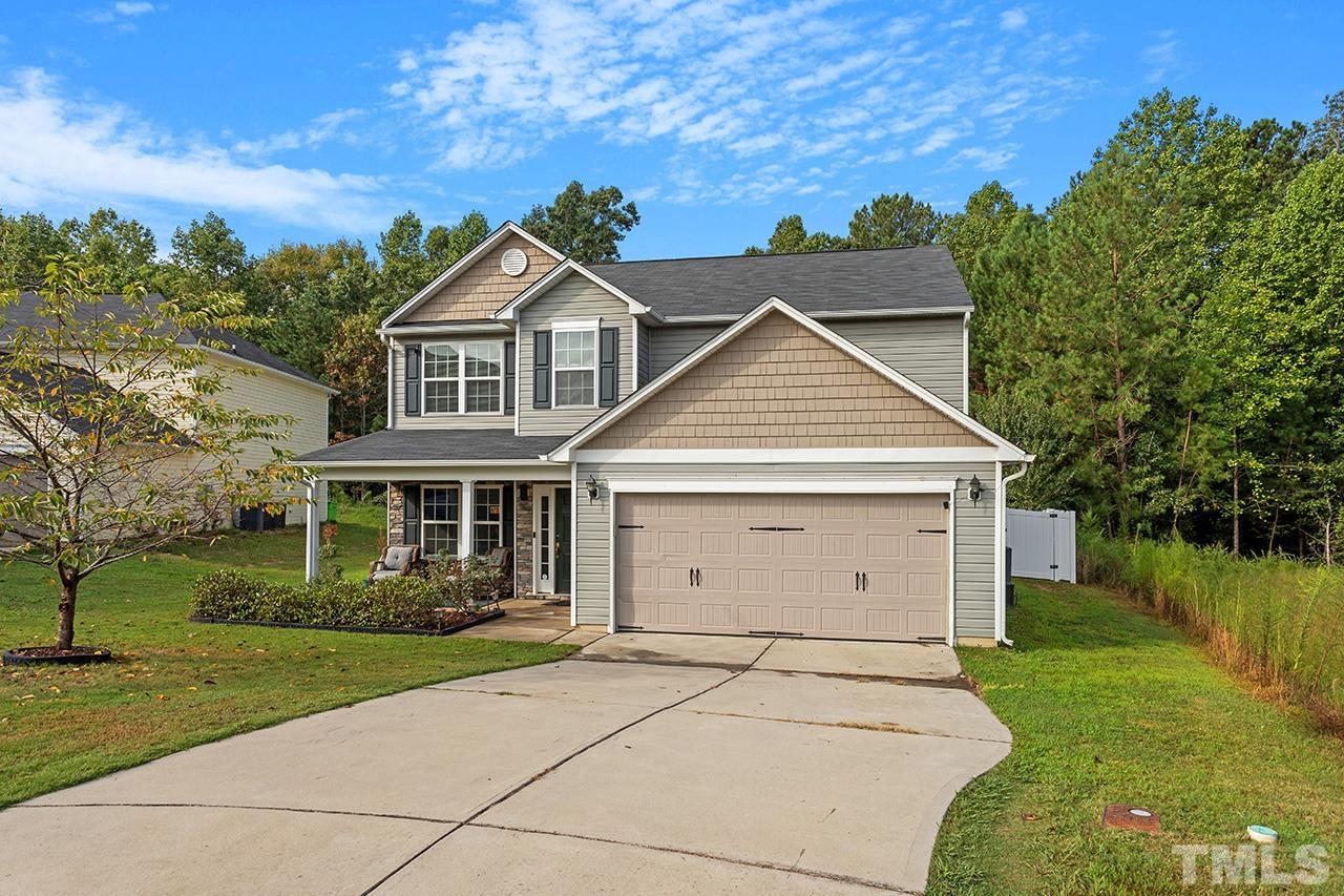 6804 Planting Court Raleigh, NC 27610 - Photo 3 of 37 front view of a house with a yard
