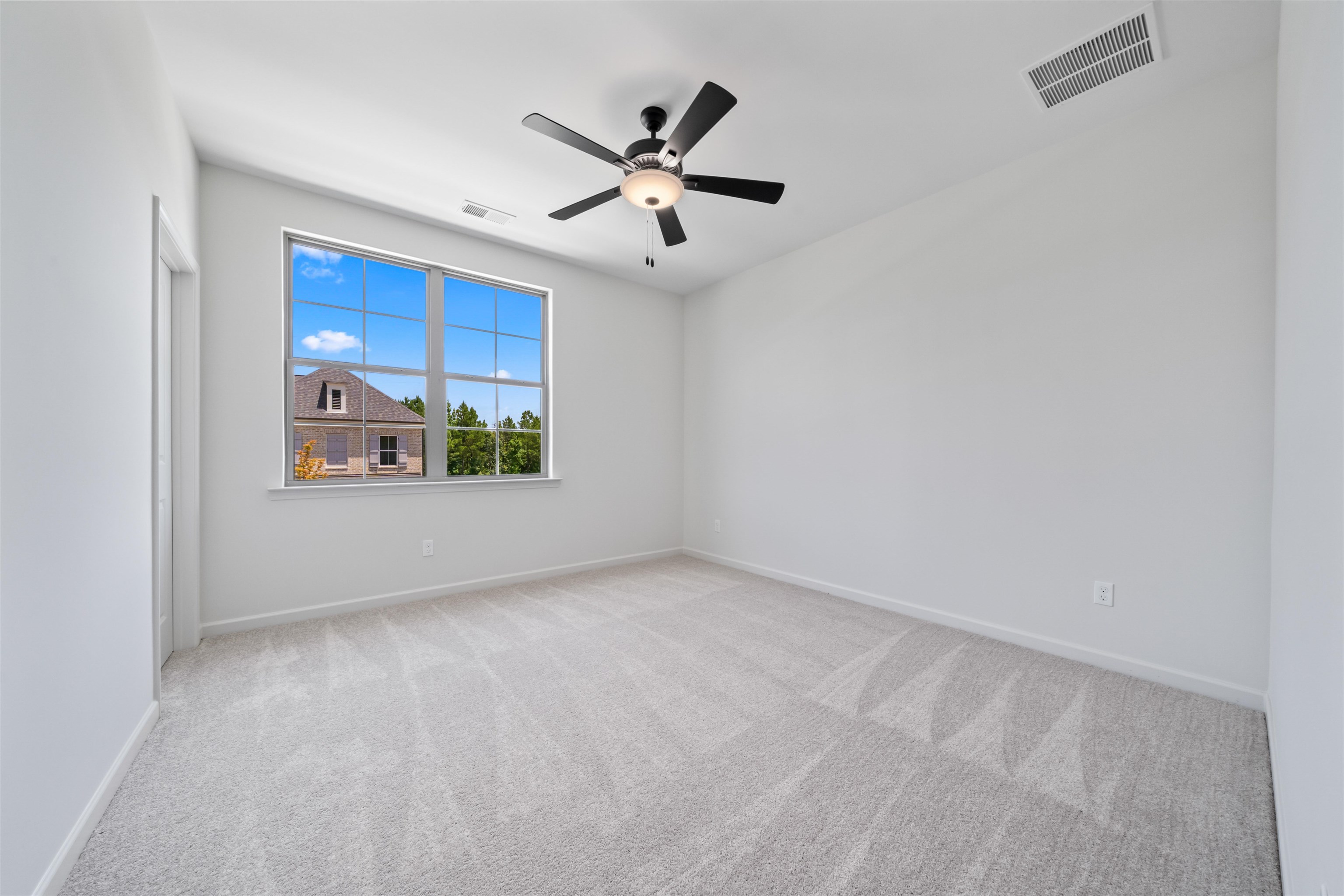 498 Armel Drive Collierville, TN 38017 - Photo 17 of 29 an empty room with windows and ceiling fan