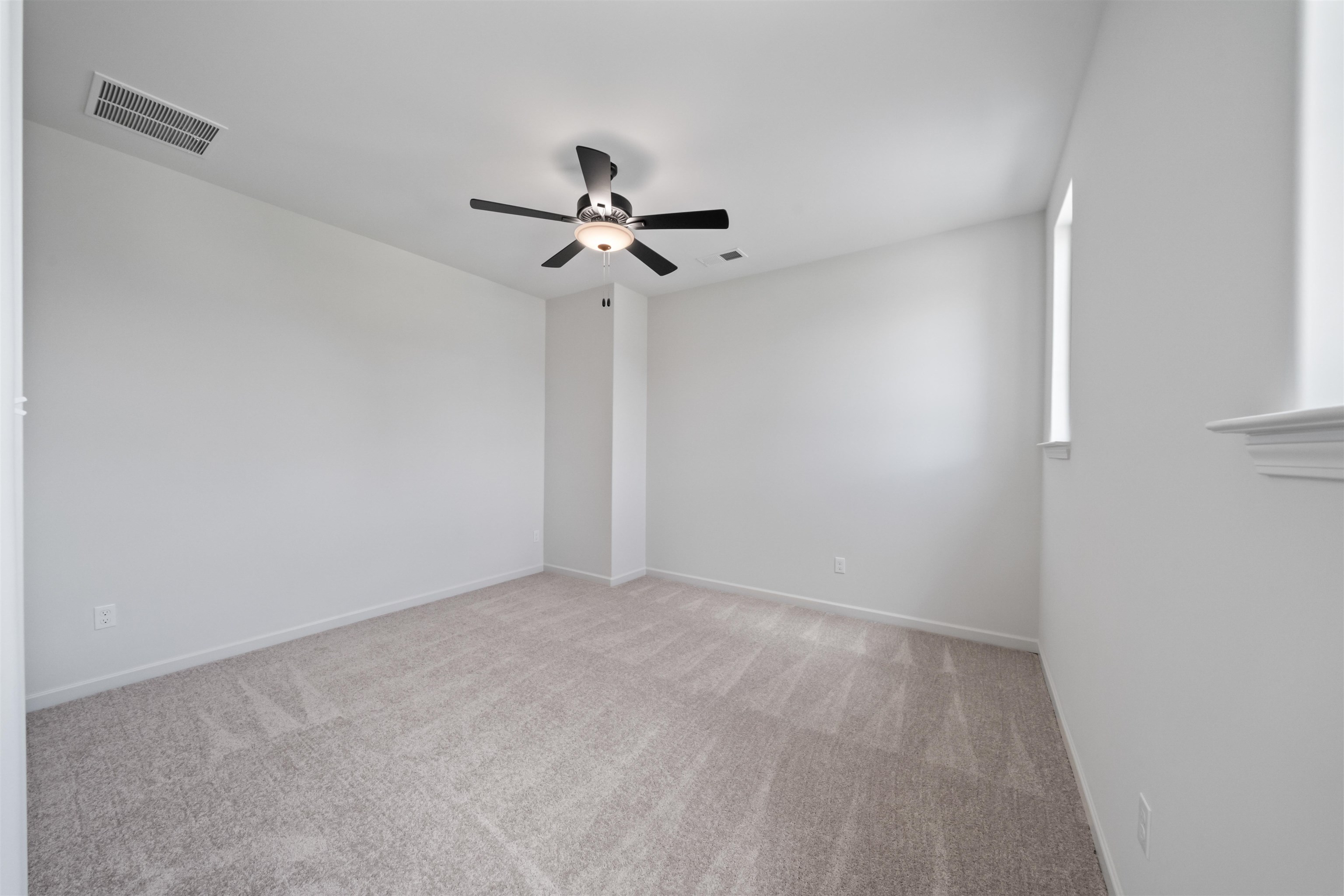 498 Armel Drive Collierville, TN 38017 - Photo 19 of 29 a view of room with a ceiling fan and window