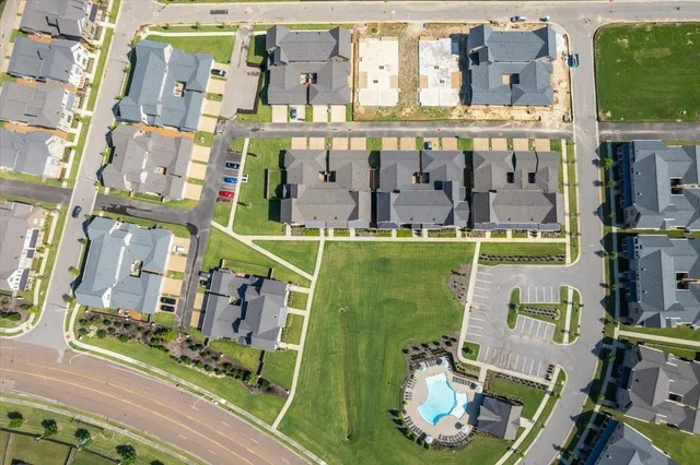 an aerial view of a house with a garden