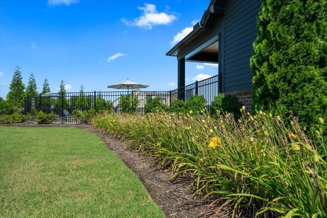a view of a house with backyard and porch