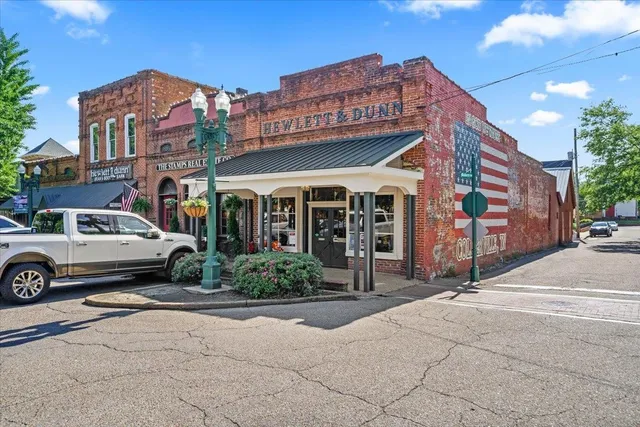 a front view of a building with garden