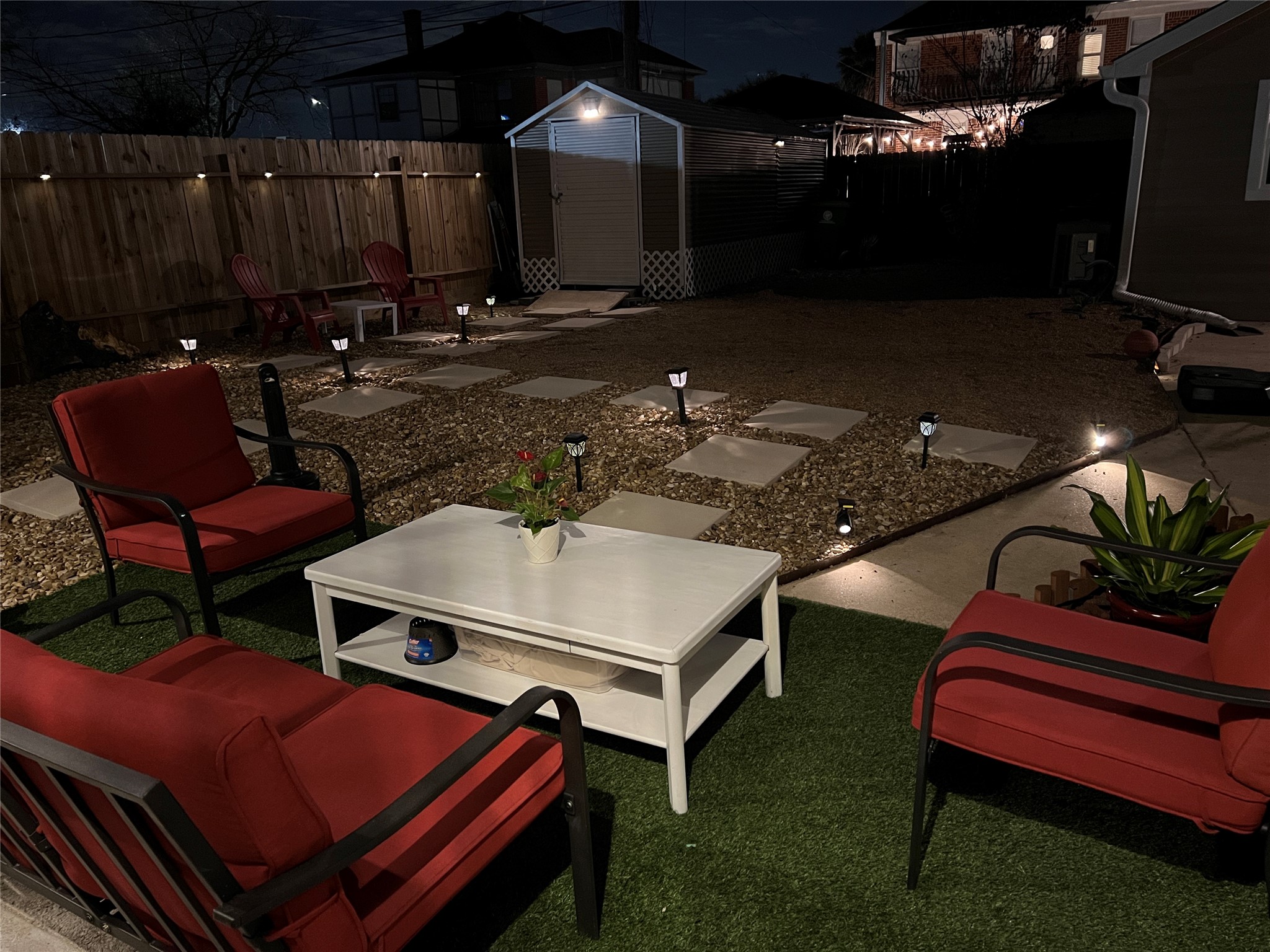 1909 Ruth Street Houston, TX 77004 - Photo 32 of 35 a outdoor dining space with furniture and a fireplace