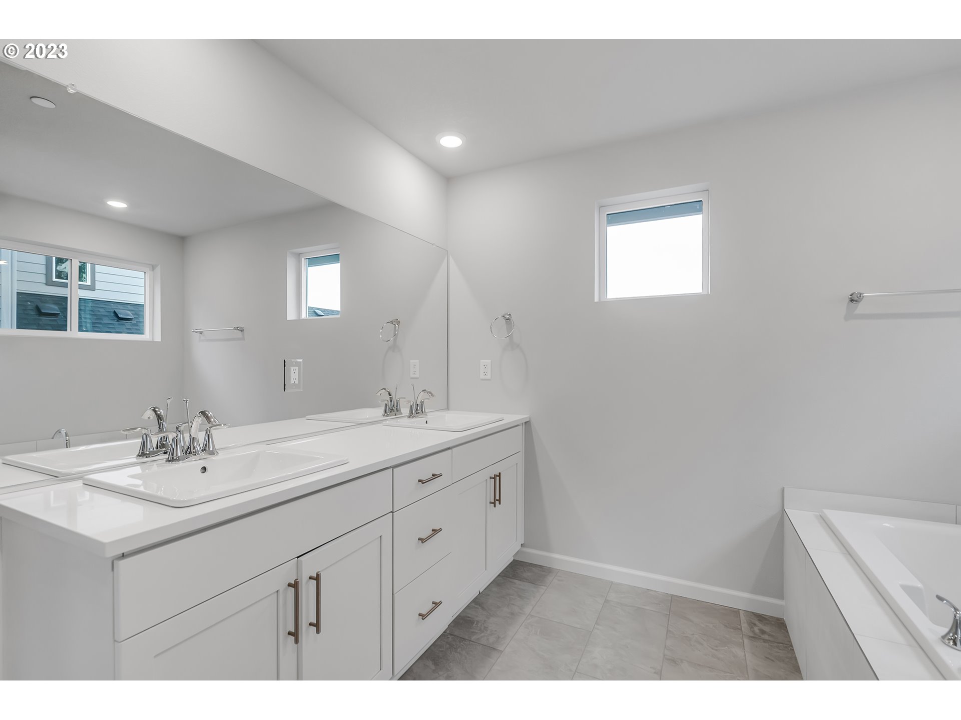2638 South 7th Circle Ridgefield, WA 98642 - Photo 14 of 22 a bathroom with a sink a vanity and mirror