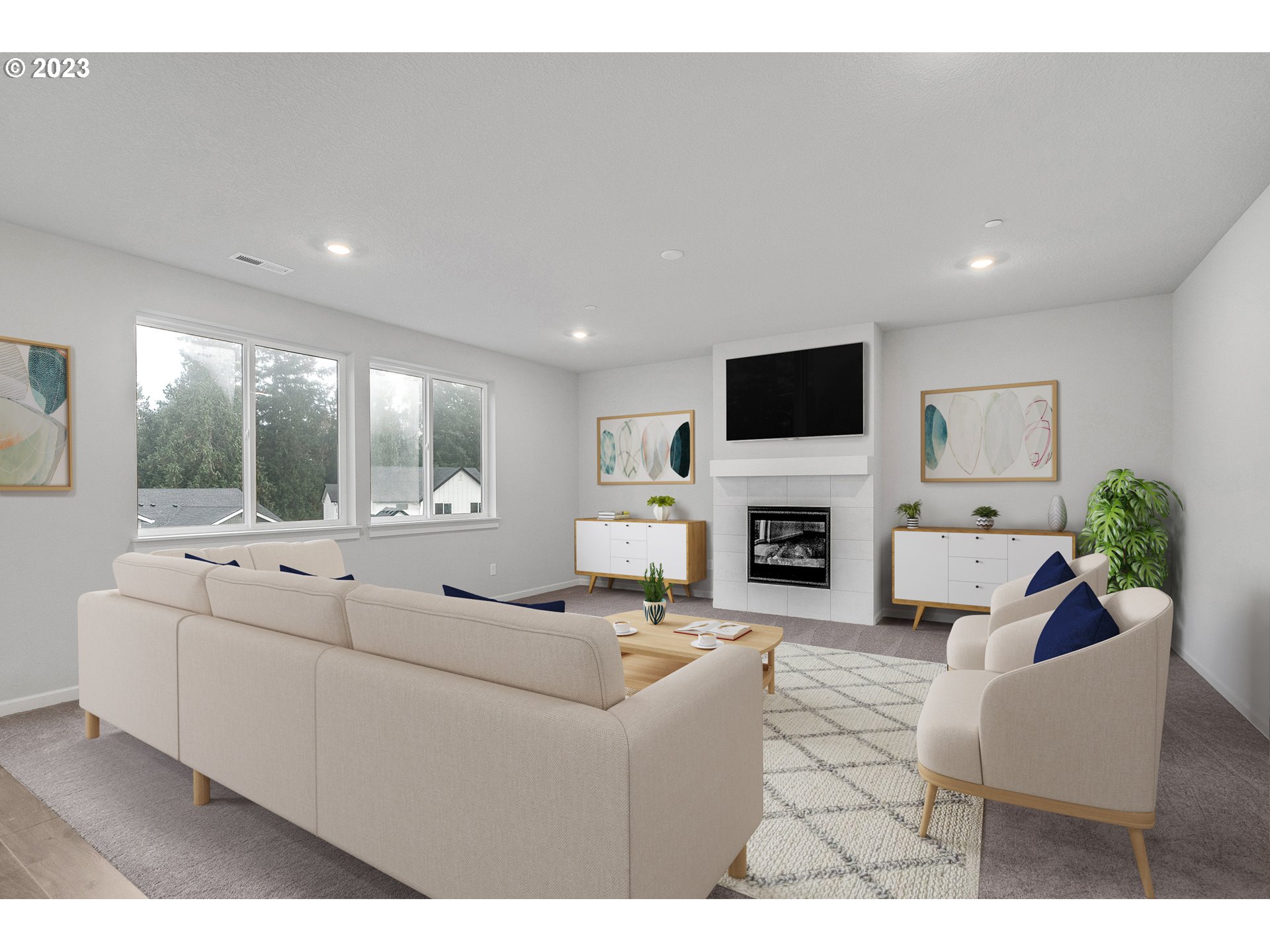2638 South 7th Circle Ridgefield, WA 98642 - Photo 10 of 22 a living room with furniture a fireplace and a flat screen tv