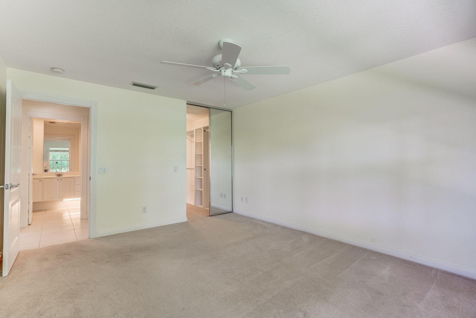 923 Magdalena Road Palm Beach Gardens, FL 33410 - Photo 12 of 47 an empty room with fan and entrance