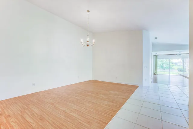 a view of an empty room with glass door