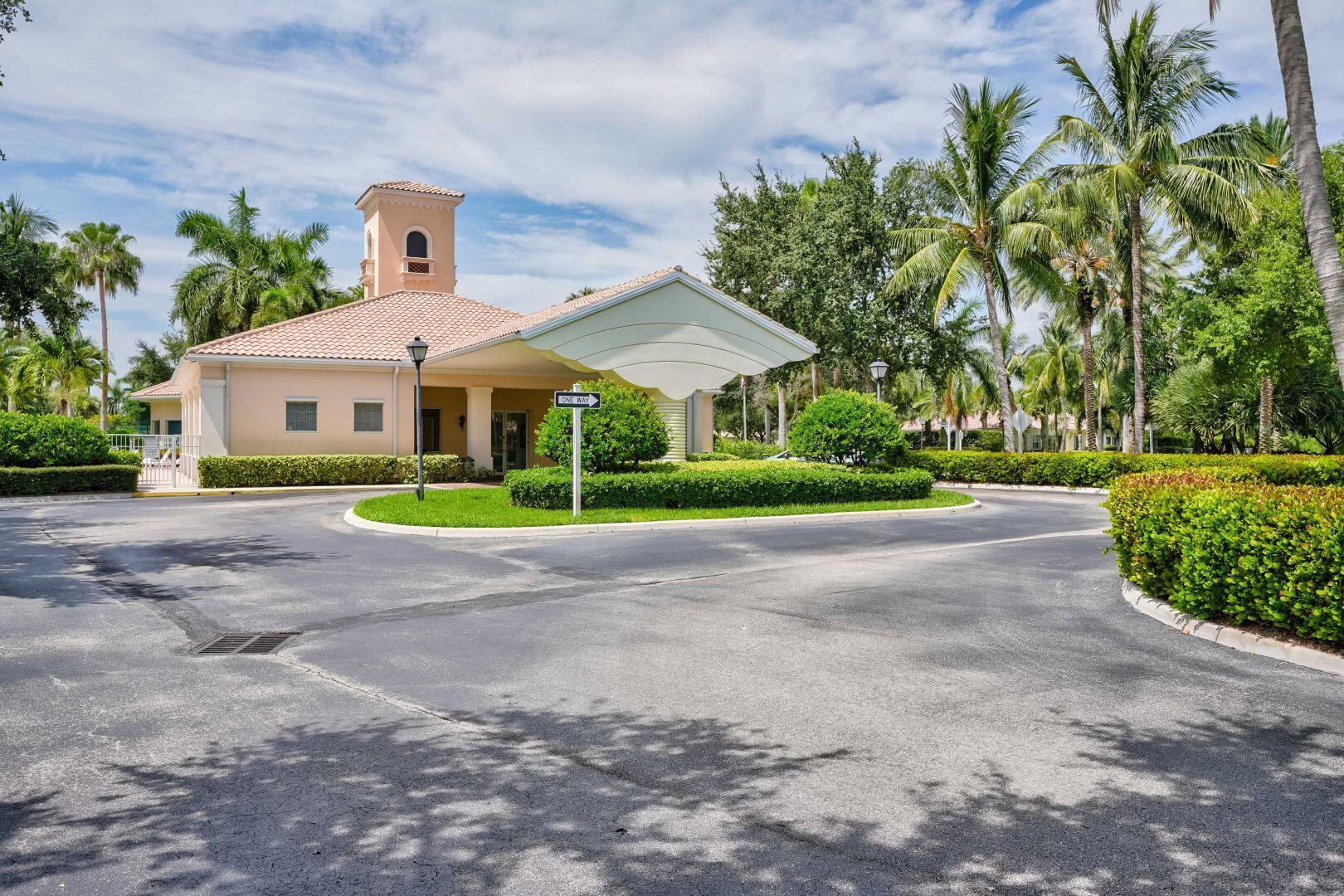 923 Magdalena Road Palm Beach Gardens, FL 33410 - Photo 33 of 47 a front view of house with yard and green space