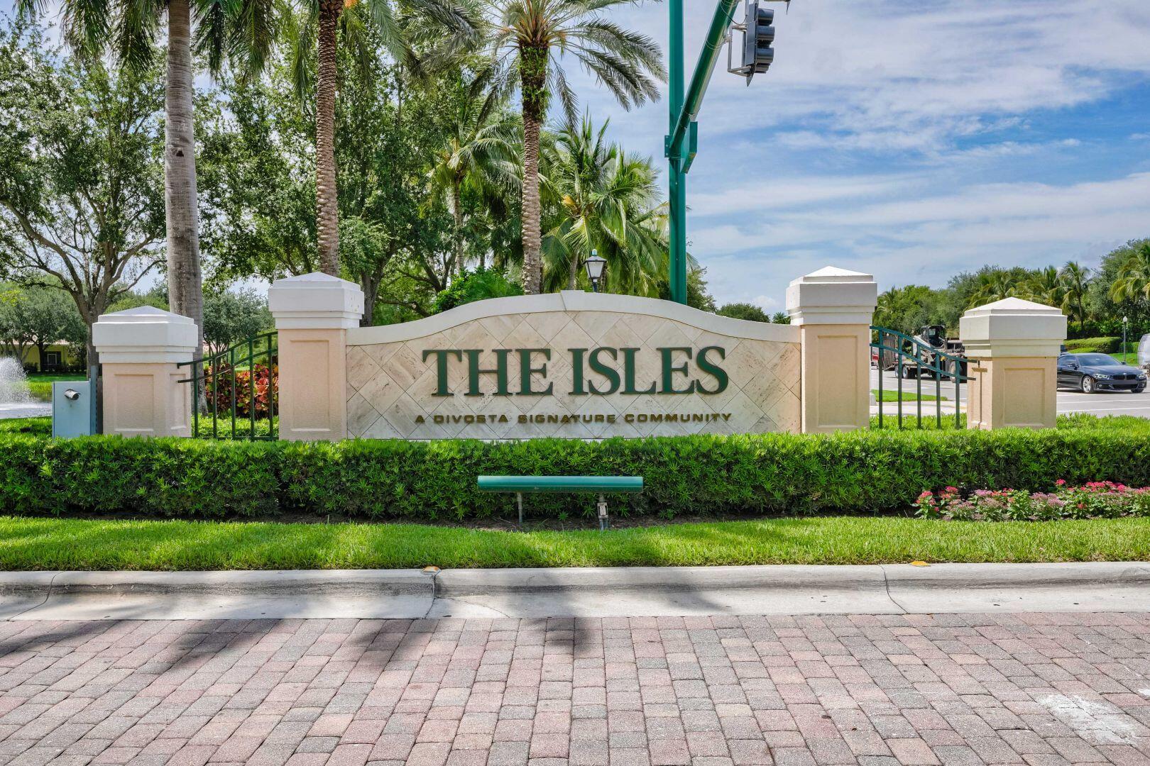 923 Magdalena Road Palm Beach Gardens, FL 33410 - Photo 34 of 47 a view of a brick house with a yard