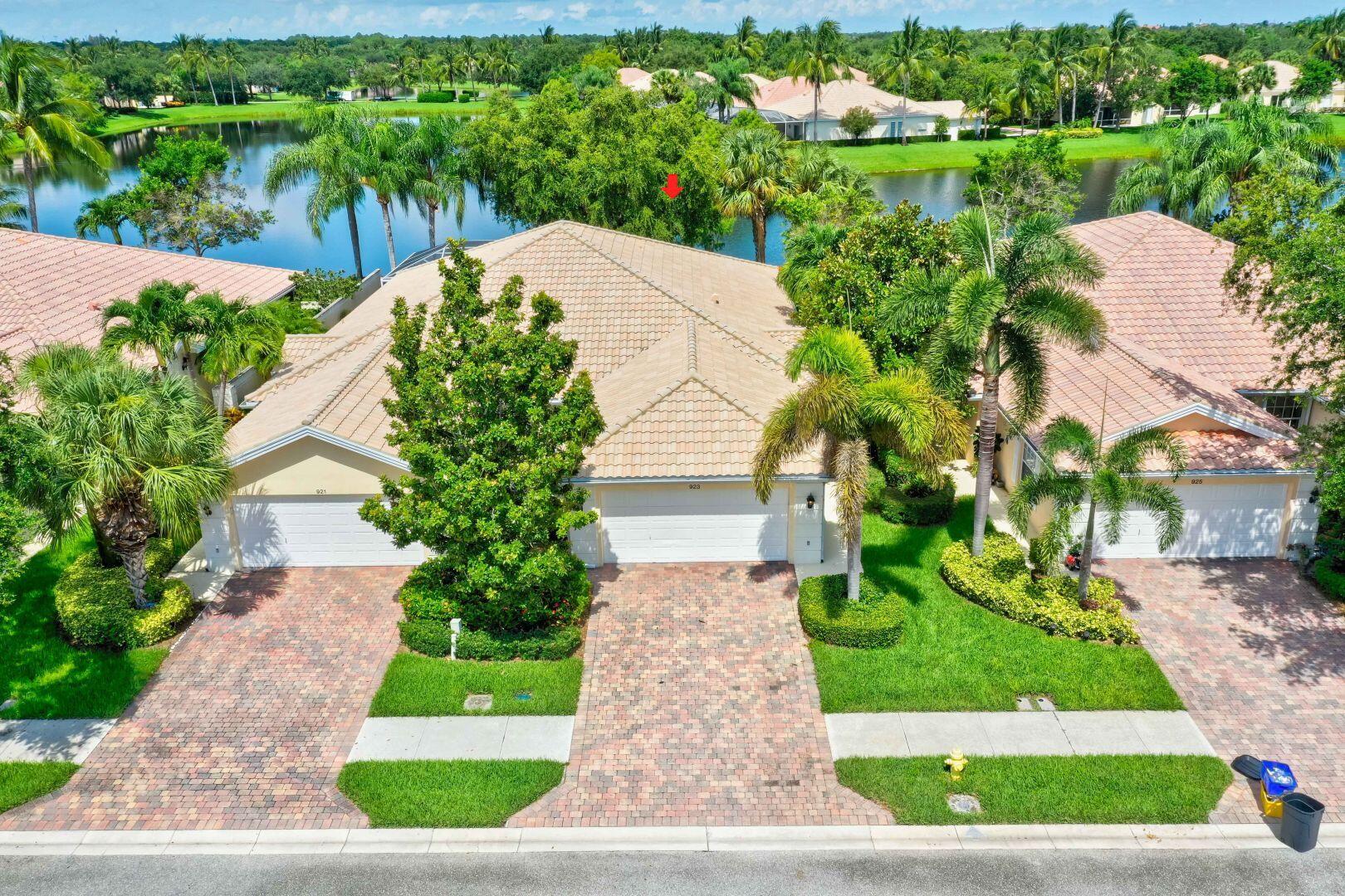 923 Magdalena Road Palm Beach Gardens, FL 33410 - Photo 37 of 47 a view of a garden with potted plants
