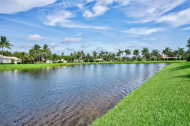 a view of a lake with houses in the back