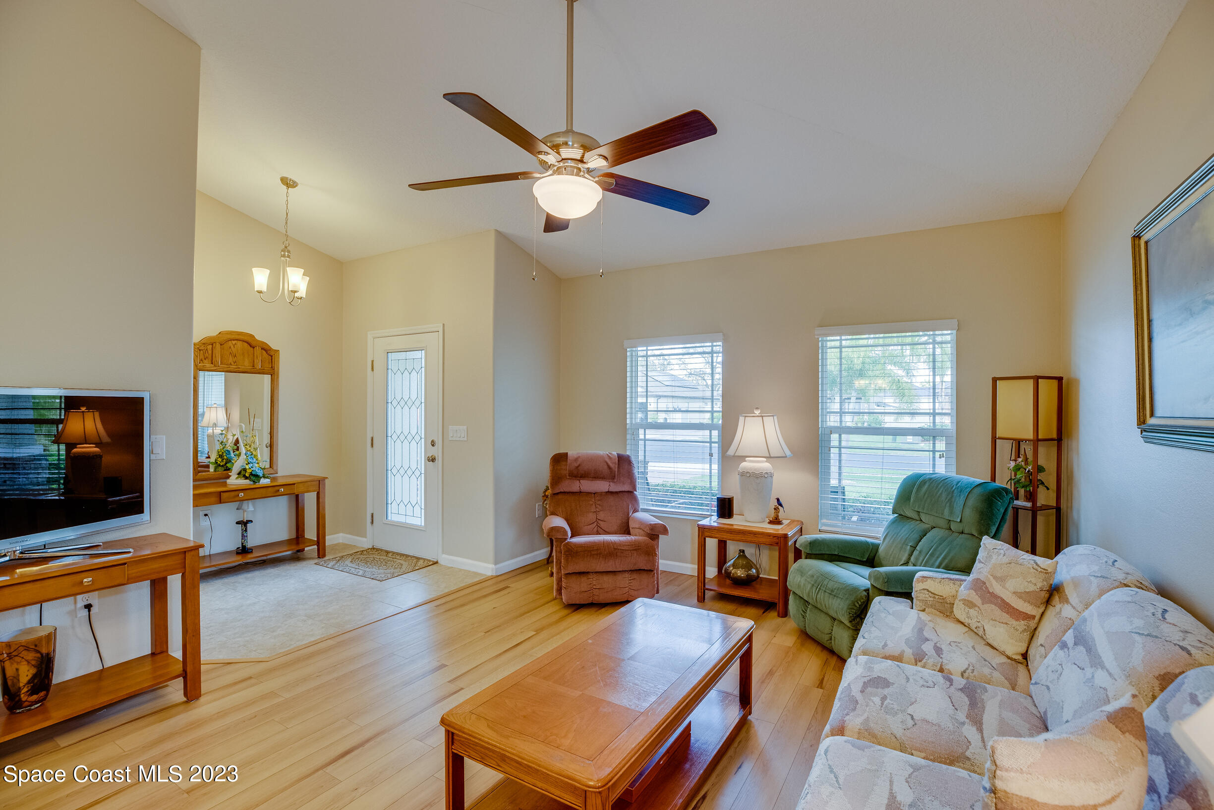 Undisclosed Address Melbourne, FL 32901 - Photo 12 of 53 a living room with furniture and a flat screen tv