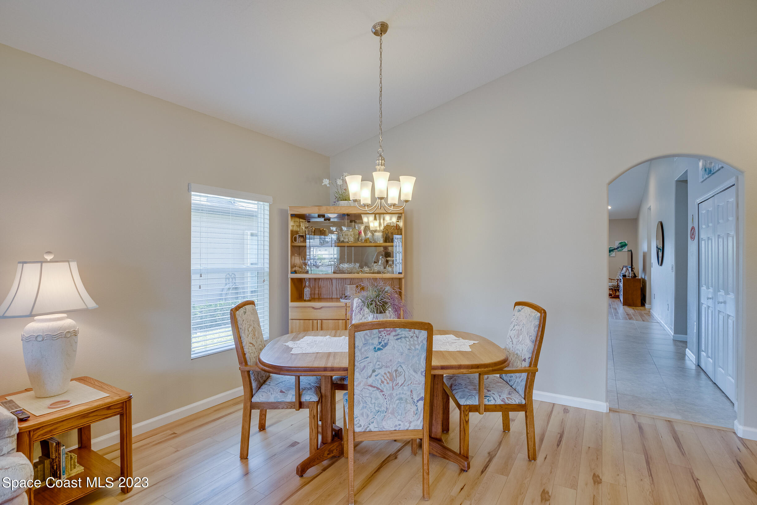 Undisclosed Address Melbourne, FL 32901 - Photo 15 of 53 a view of a dining room with furniture window and wooden floor