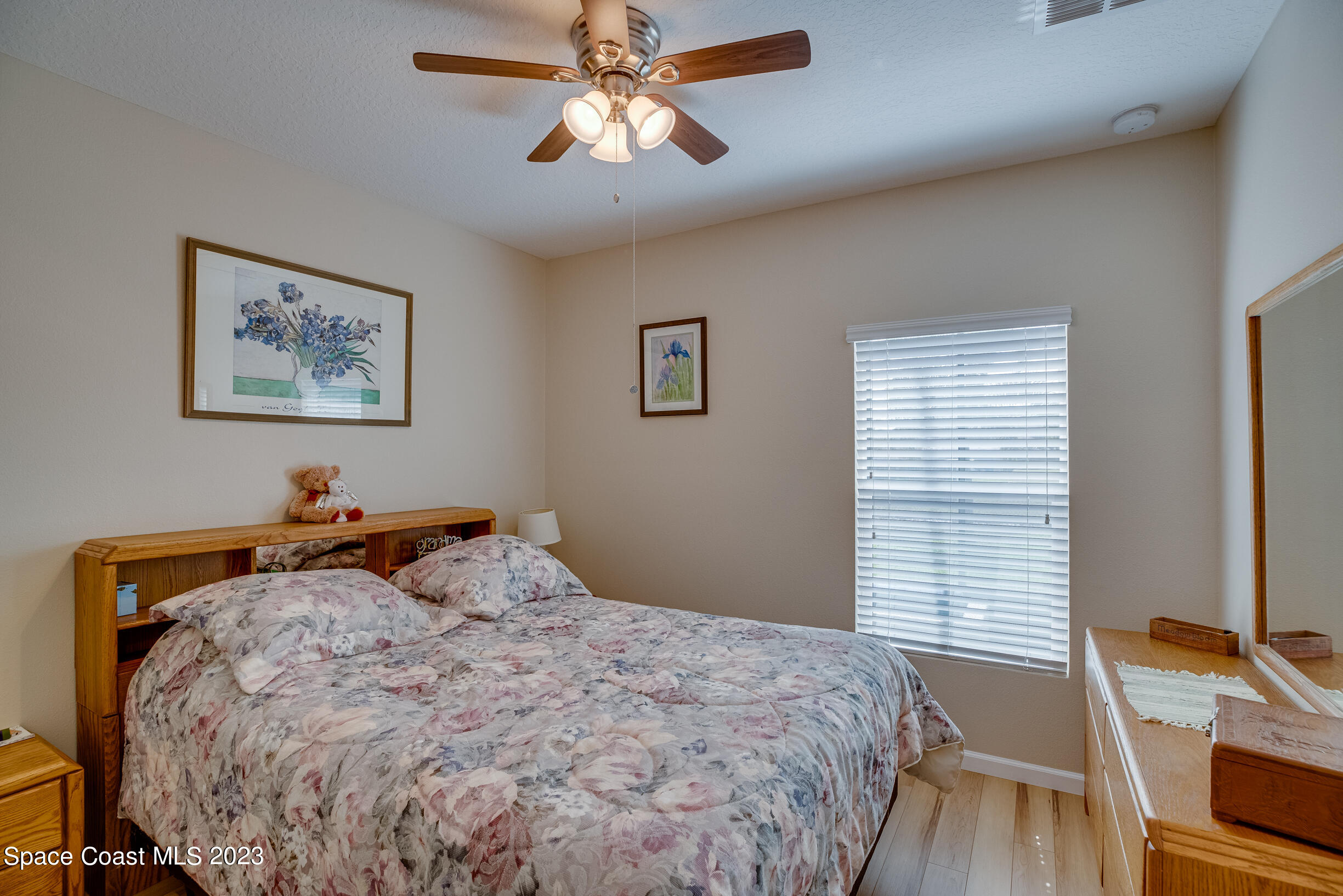 Undisclosed Address Melbourne, FL 32901 - Photo 34 of 53 a bedroom with a bed and a chandelier