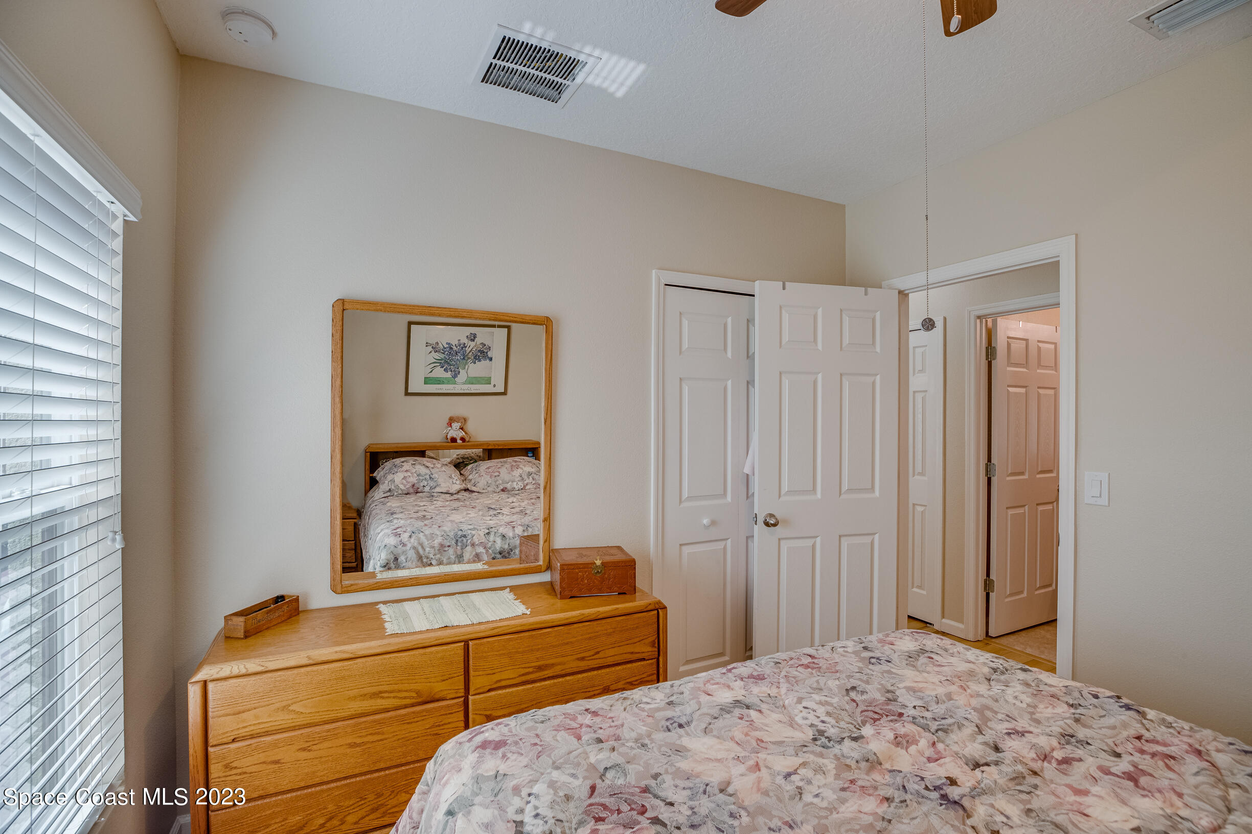 Undisclosed Address Melbourne, FL 32901 - Photo 35 of 53 a bedroom with a bed and a chandelier