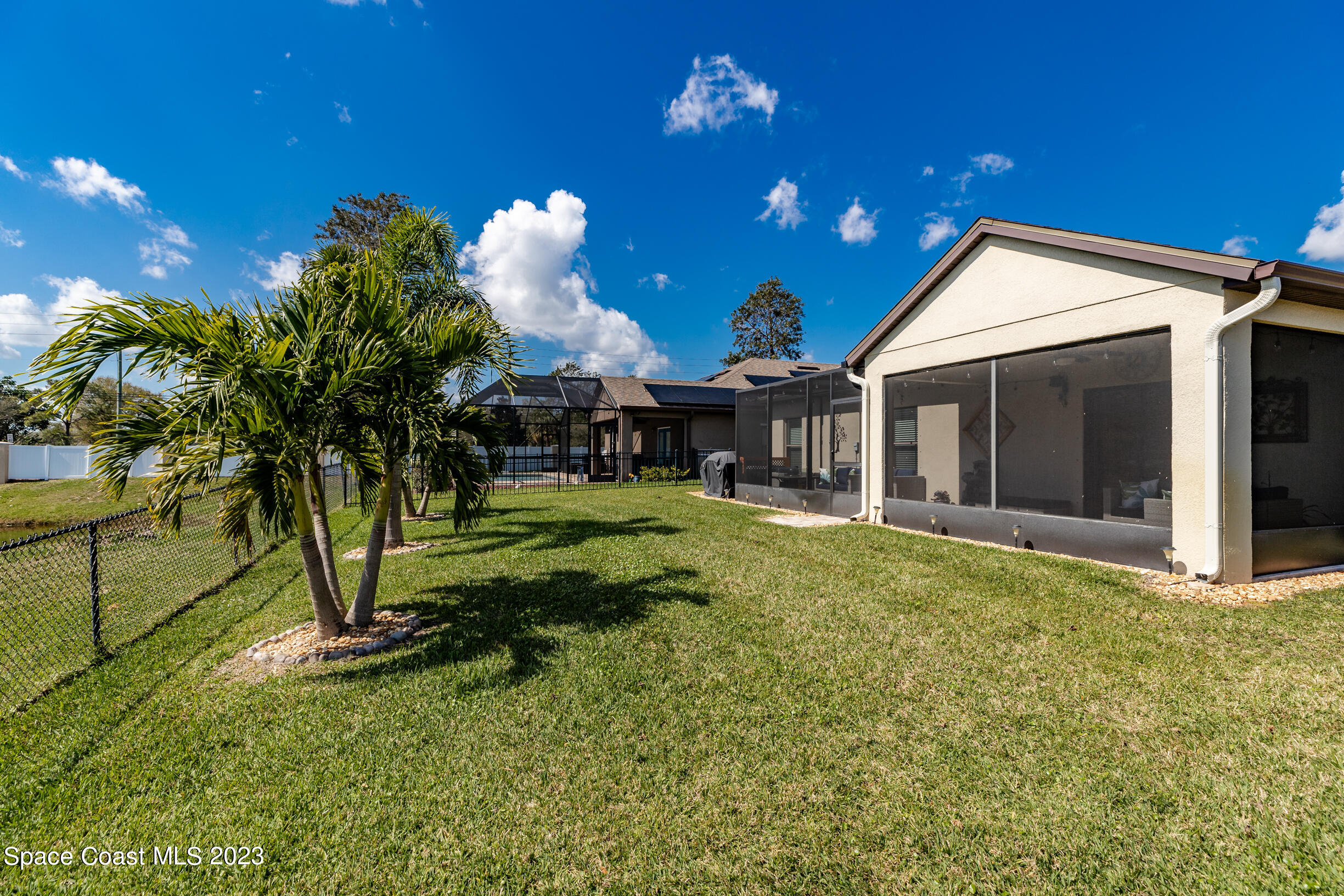 Undisclosed Address Melbourne, FL 32901 - Photo 49 of 53 a view of a house with a backyard and a tree