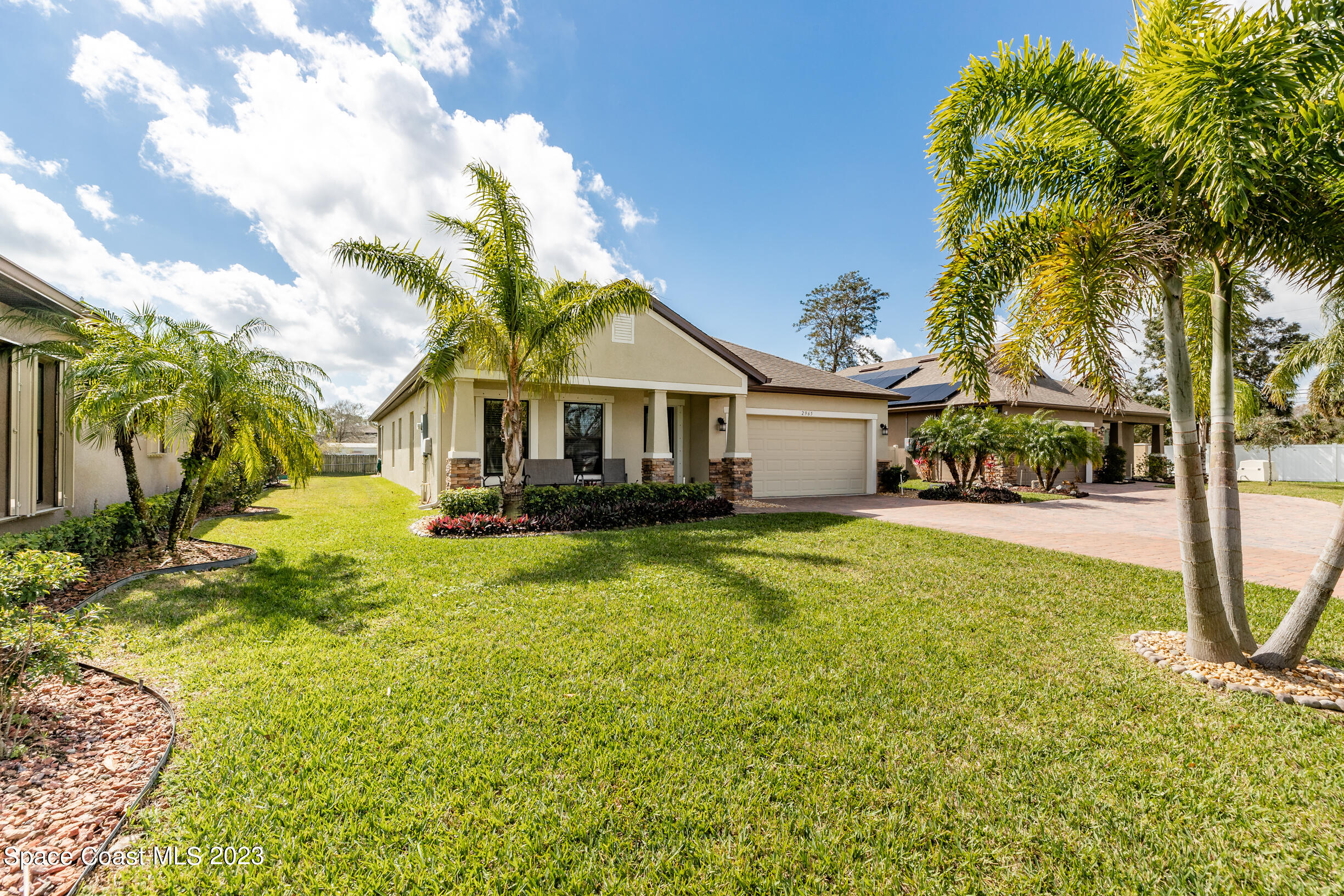 Undisclosed Address Melbourne, FL 32901 - Photo 10 of 53 a front view of a house with swimming pool