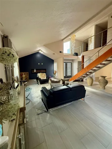 a living room with furniture and a rug