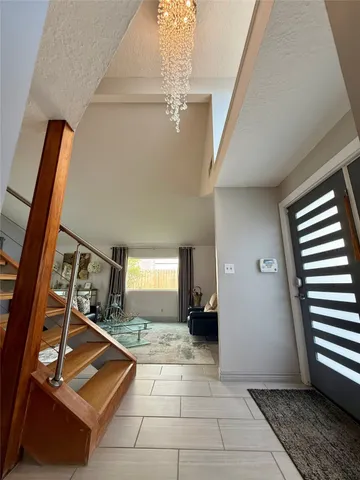 a kitchen with a sink a counter top space cabinets and stainless steel appliances