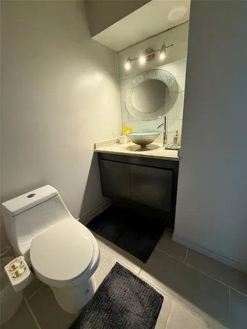 a bedroom with a bed couch and a window