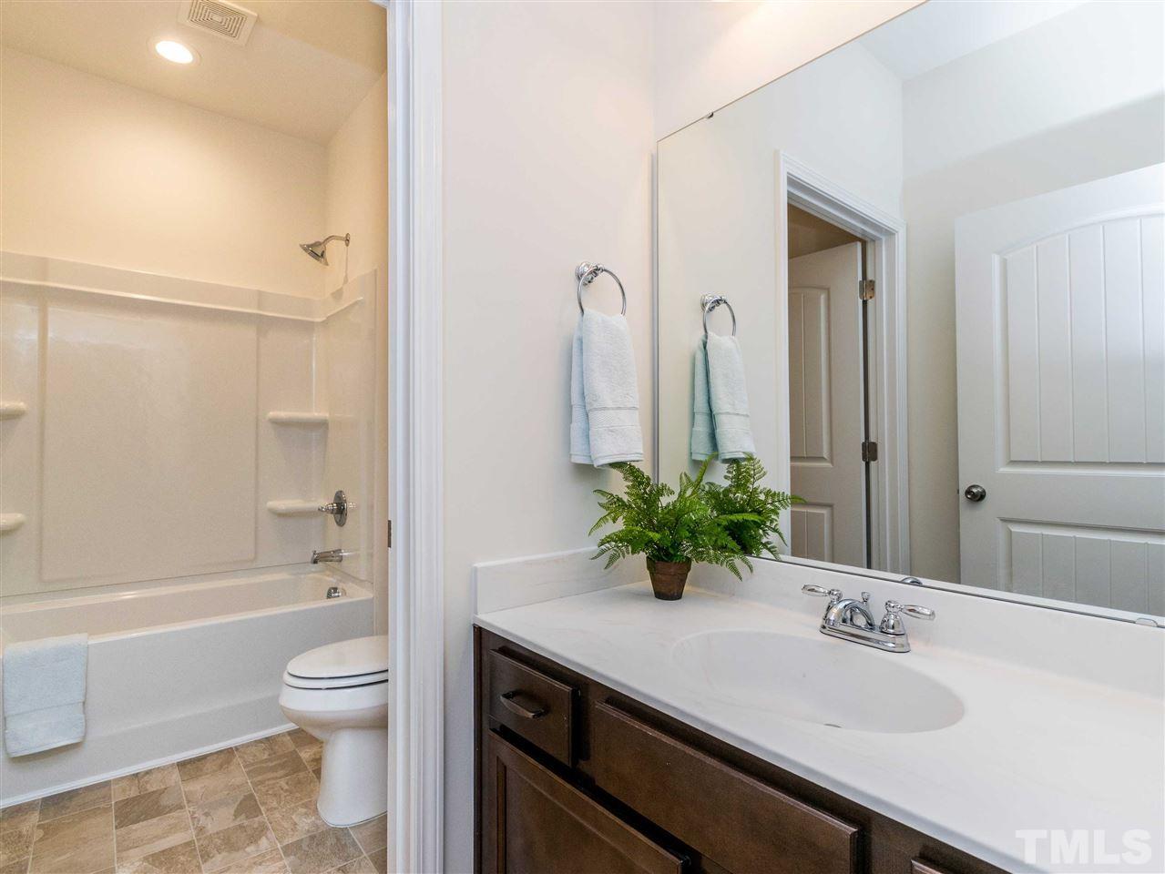 76 Springhill Lane Garner, NC 27529 - Photo 25 of 25 This full size bathroom is right outside the 2 bedrooms in this floor plan for sharing.