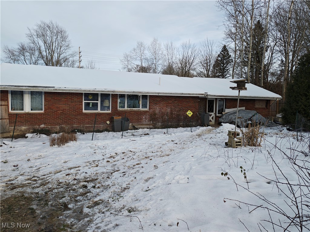 7407 Jefferson Road Ashtabula, OH 44004 - Photo 15 of 15 Snow covered back of property with brick siding