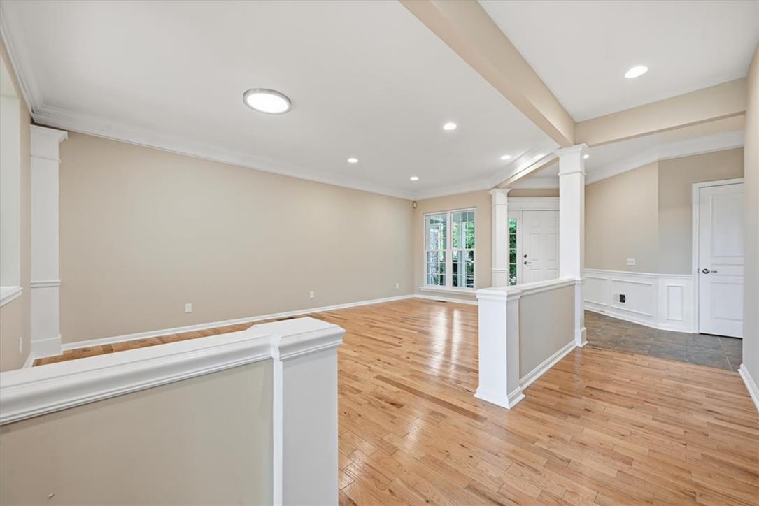 8761 Cascade Road Breinigsville, PA 18031 - Photo 16 of 84 Warm hardwood floors and recessed lighting illuminate this inviting, open-concept living space.