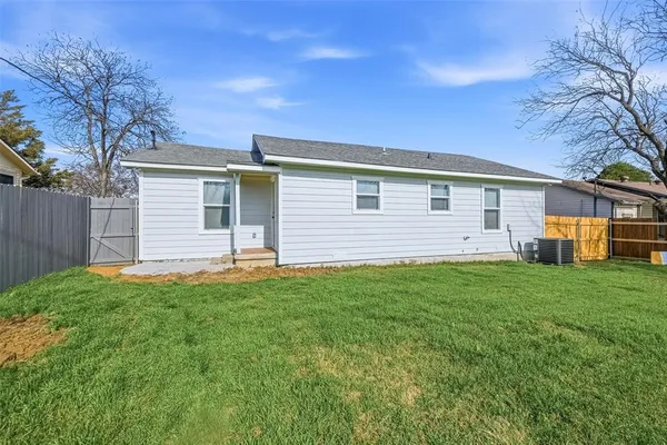 a view of yard with swimming pool and green space