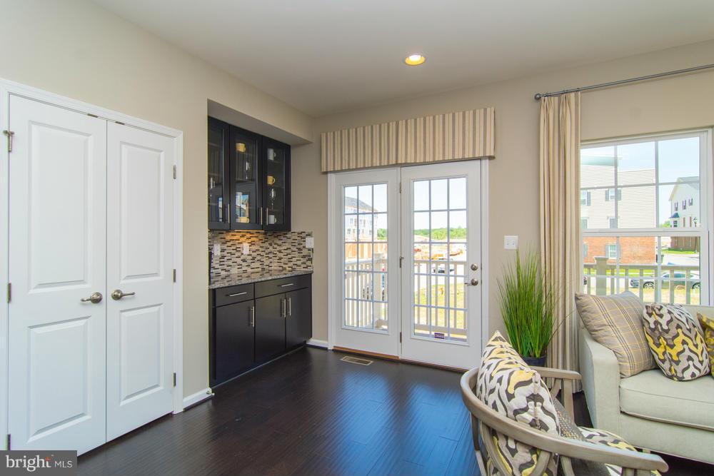 7635 Telamon Way Hanover, MD 21076 - Photo 30 of 30 a living room with furniture and wooden floor