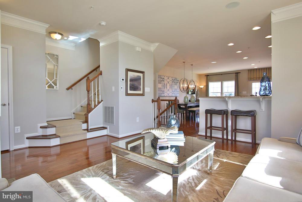 7635 Telamon Way Hanover, MD 21076 - Photo 6 of 30 a living room with furniture and view of kitchen