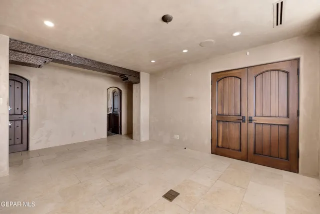 a bathroom with a glass shower door
