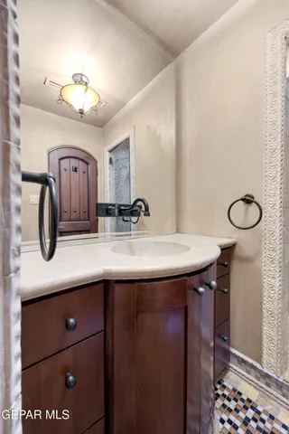 a bathroom with a sink and a mirror