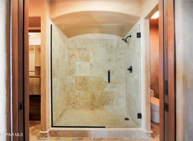 a view of a swimming pool with outdoor seating and a garden