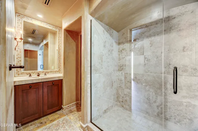 a view of a chairs and table in patio with a lake view