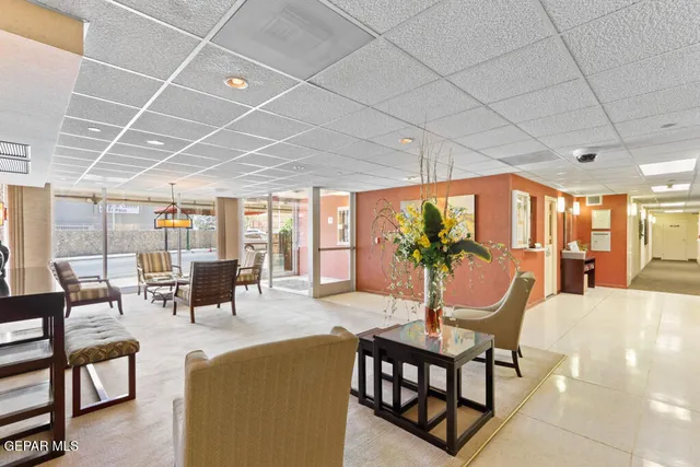 an empty room with wooden floor and sliding glass door