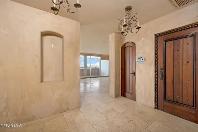 a view of a kitchen with a sink and a refrigerator