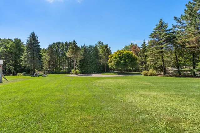a view of outdoor space with deck and trees
