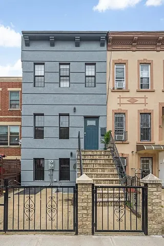 a view of a balcony with city street
