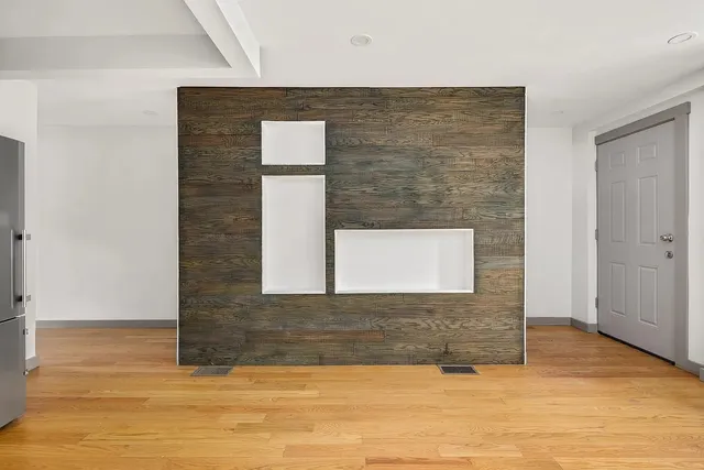 a kitchen with stainless steel appliances a refrigerator and a stove top oven