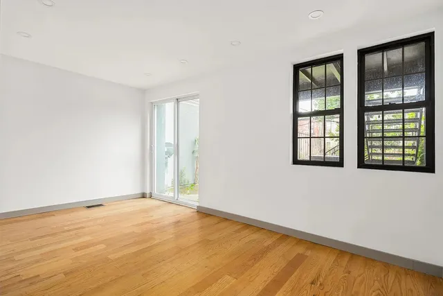 a bathroom with a sink toilet a mirror and shower