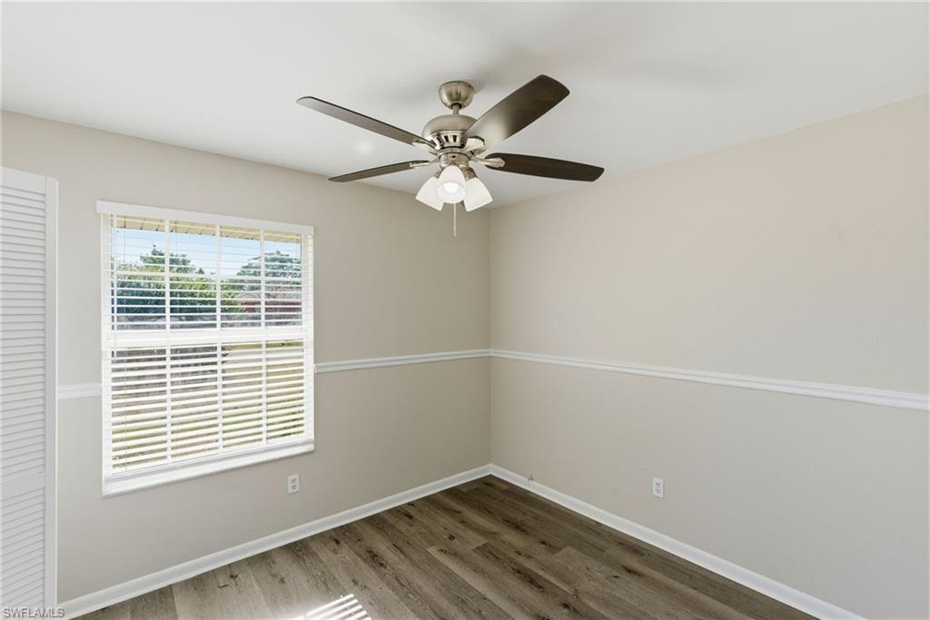 5283 17th Place Southwest Naples, FL 34116 - Photo 15 of 20 a view of an empty room with a window and a ceiling fan