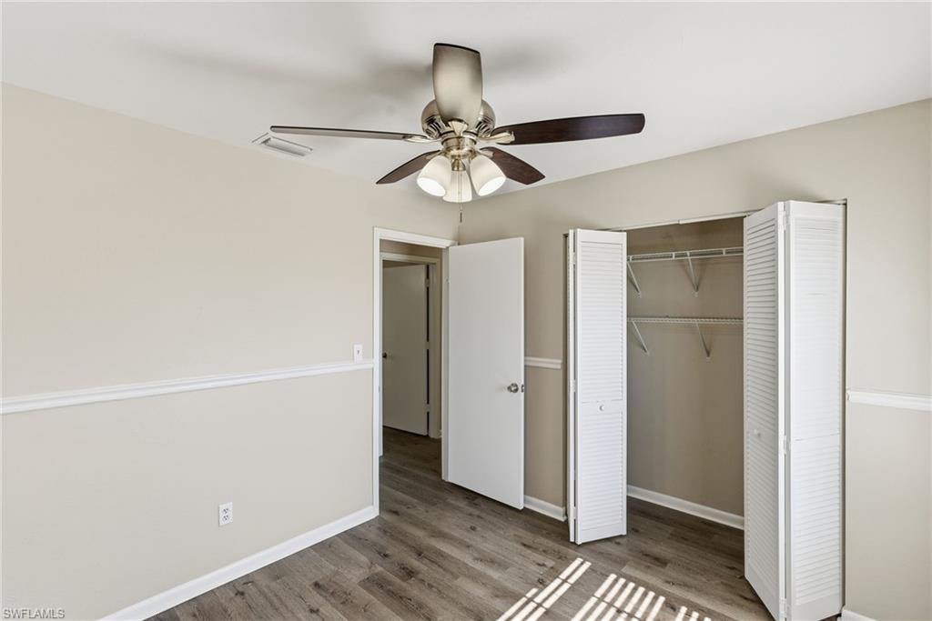5283 17th Place Southwest Naples, FL 34116 - Photo 16 of 20 a view of a chandelier fan and refrigerator in a kitchen