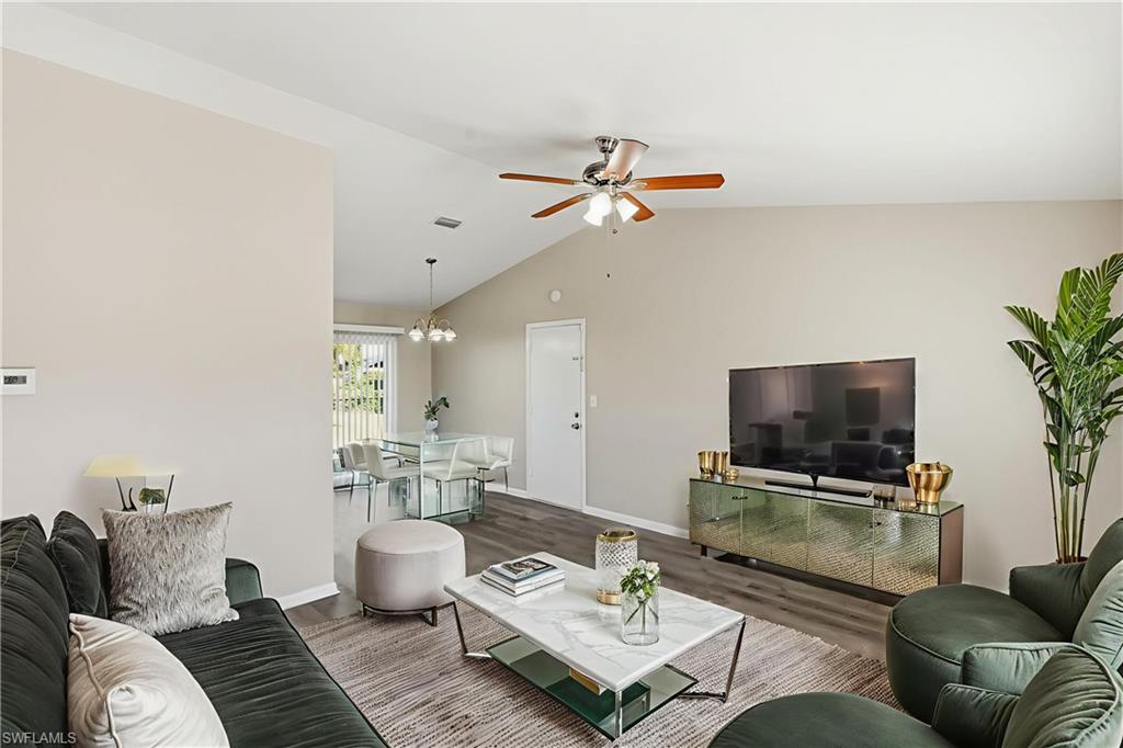 5283 17th Place Southwest Naples, FL 34116 - Photo 3 of 20 a living room with furniture and a flat screen tv