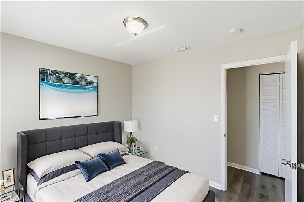 5283 17th Place Southwest Naples, FL 34116 - Photo 4 of 20 a living room with a couch and painting on the wall