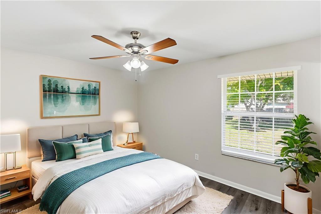 5283 17th Place Southwest Naples, FL 34116 - Photo 5 of 20 a bedroom with a bed and a window