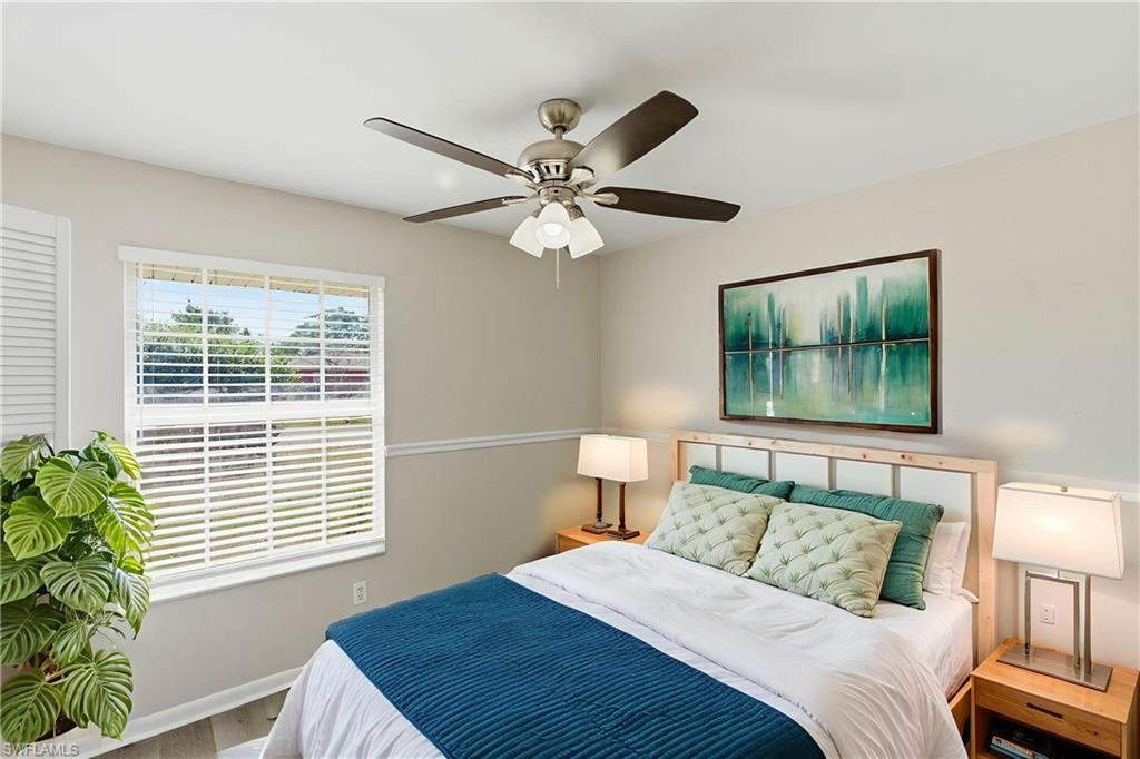 5283 17th Place Southwest Naples, FL 34116 - Photo 6 of 20 a bedroom with a bed and a window