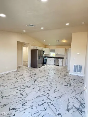 a large bathroom with a large mirror